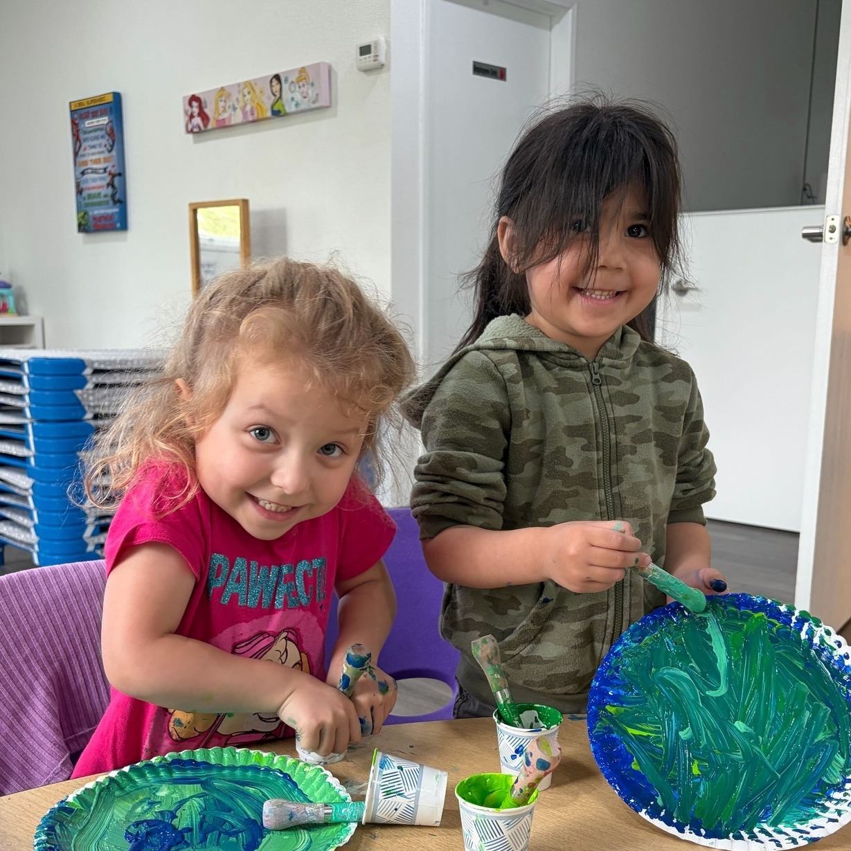 Preschool children painting at Zen Kids Care