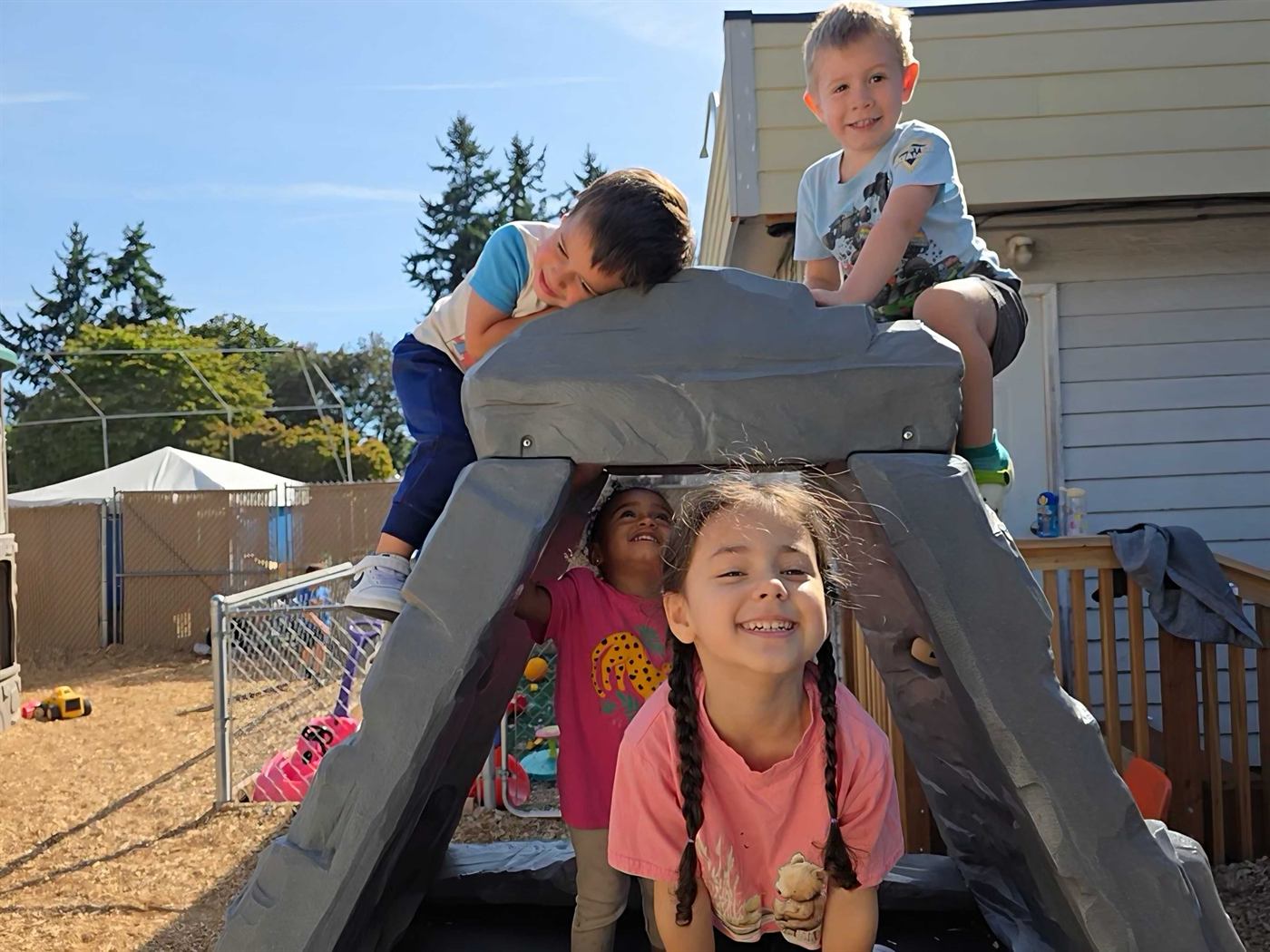 School-age children playing outdoors at Zen Kids Care
